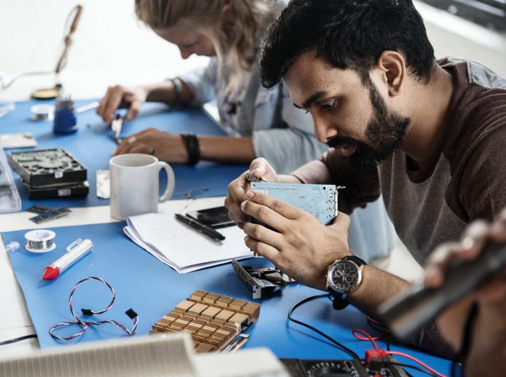 Electrical technicians working on electronics parts in inplant training in coimbatore